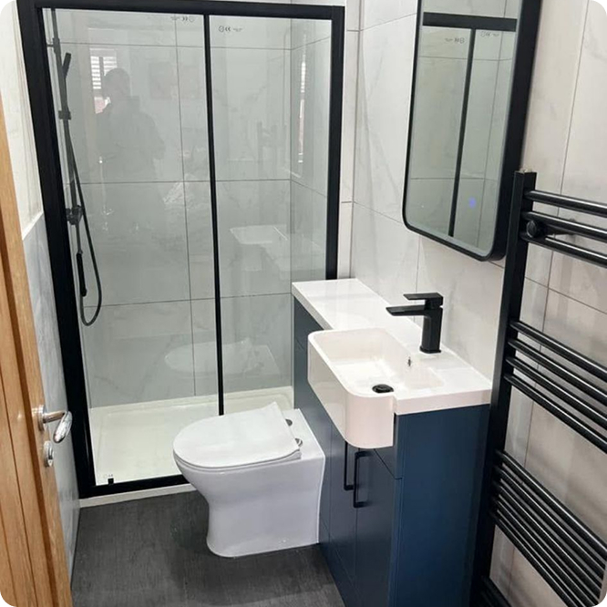 Complete fitted bathroom installation with shower, vanity and modern bathroom finishes